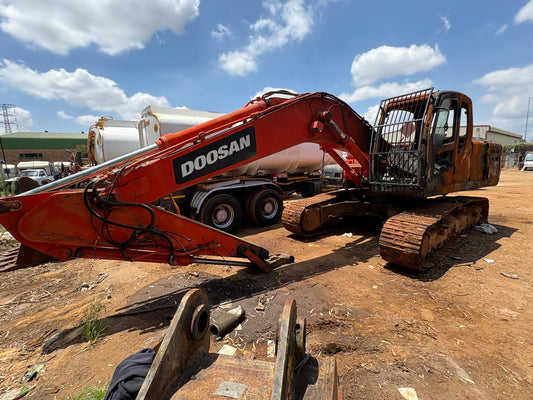 Doosan DX225LCA excavator side view on site